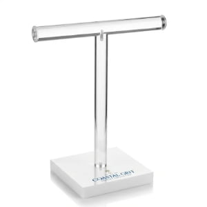 Clear acrylic T-bar necklace display stand with white base and custom brand logo for retail showrooms.