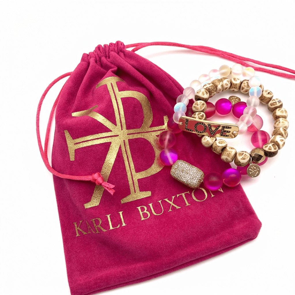 Custom drawstring jewellery pouch in velvet and linen fabric with gold foil logo for necklace and ring packaging.