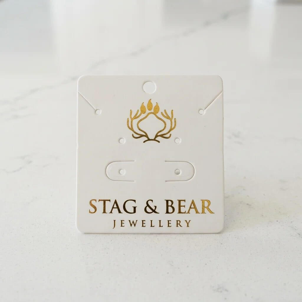 Custom 700g white paper jewelry display card with gold foil logo for necklace and earring presentation, model YJC001.