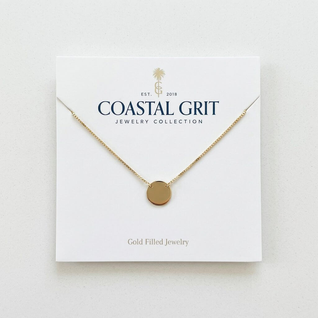 Custom 700g cardboard necklace cards with die-cut slots for earrings and studs, featuring offset printing and brand logo.