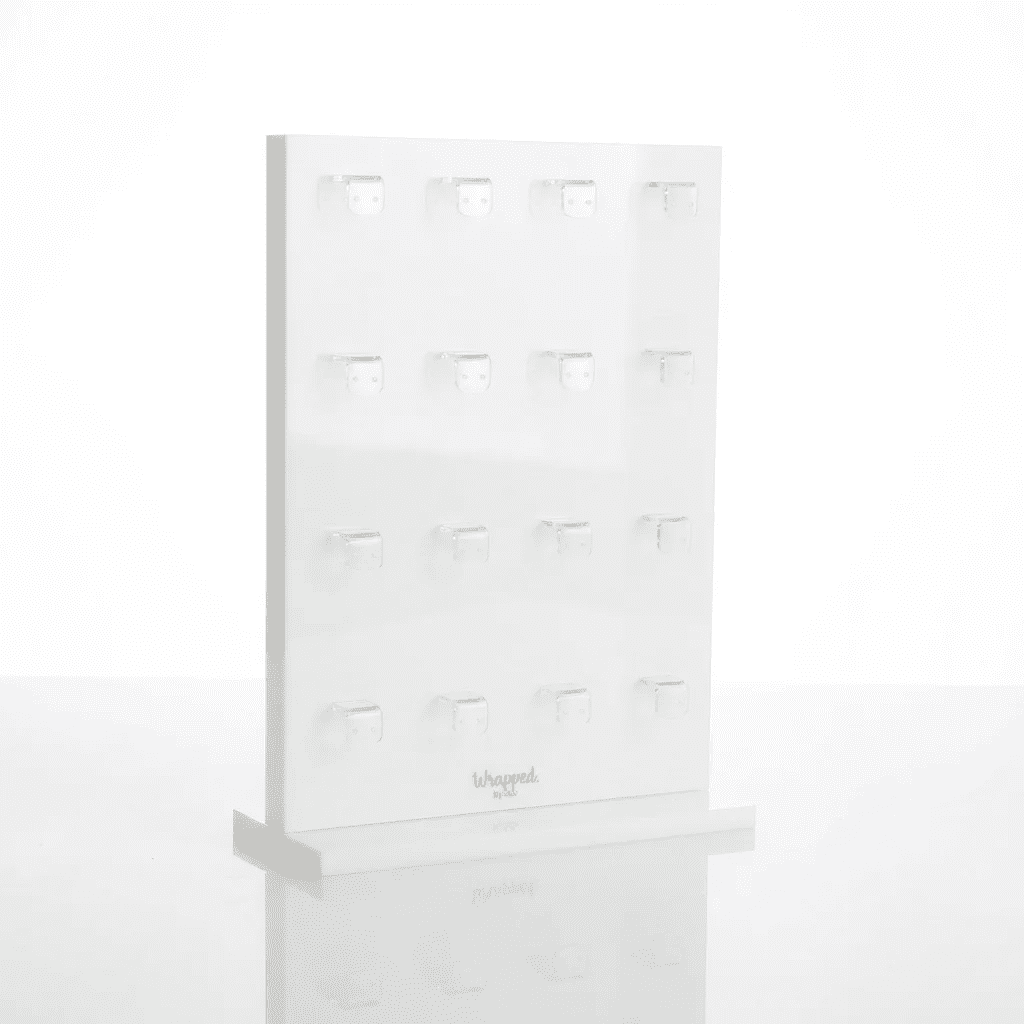 White acrylic earring display stand featuring double-sided hanging holes for studs and pendants with a sturdy detachable base.