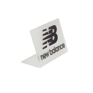 Frosted acrylic tabletop L-shaped logo display sign with custom silk-screen printing for retail branding.