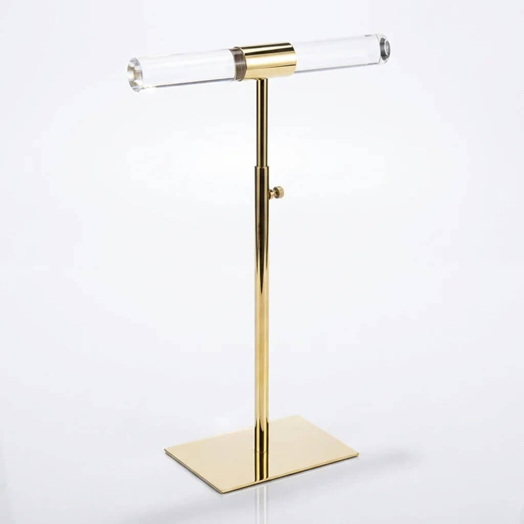 Adjustable gold T-bar jewelry stand with a 1.2" diameter clear acrylic rod for necklace and bracelet display.