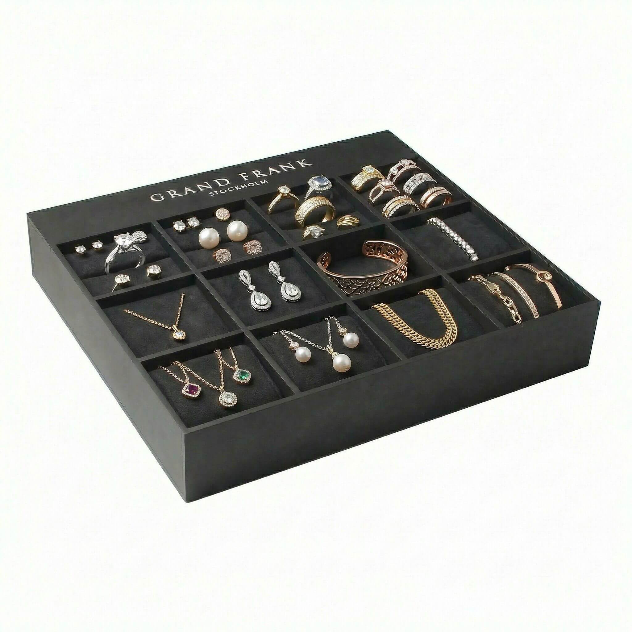 Professional jewelry display box with 12 slots for shop counters, featuring a matte black finish and custom logo inserts.