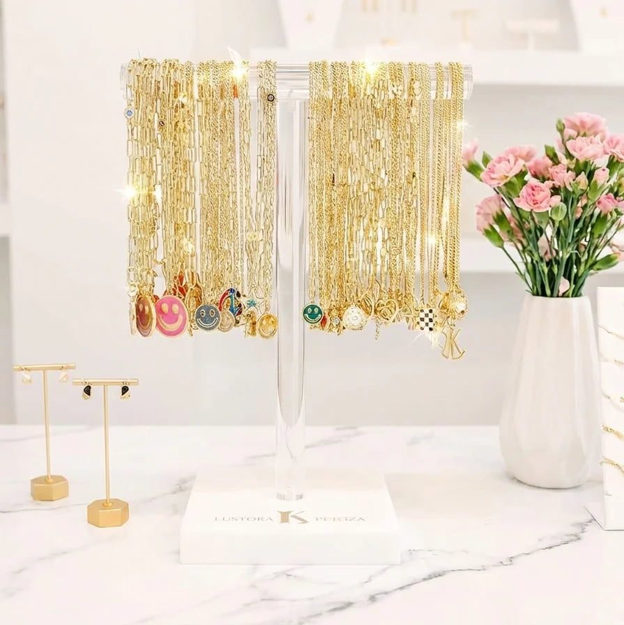 Commercial grade acrylic T-bar stand with clear top and white weighted base for professional necklace display.