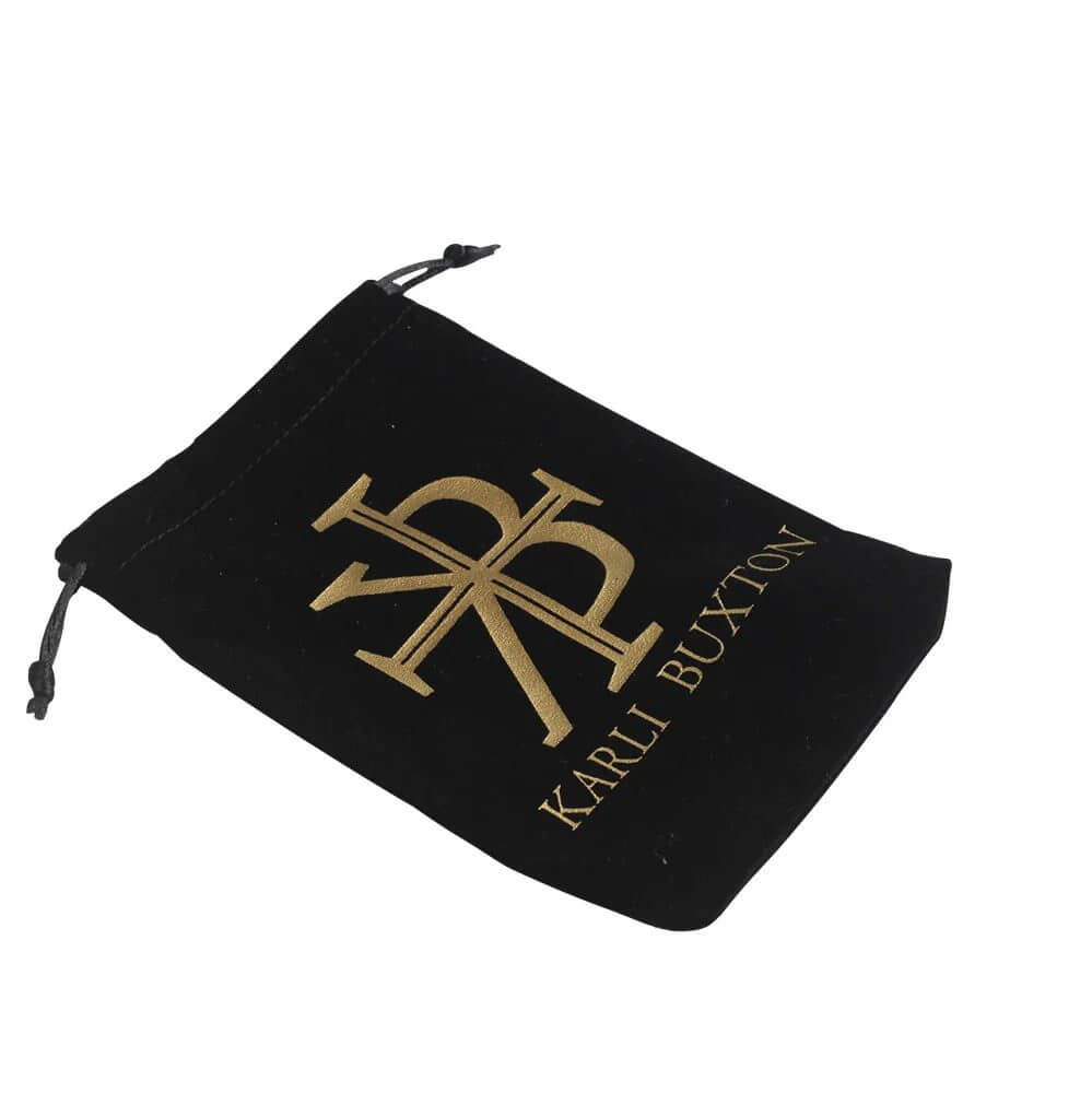 Custom velvet drawstring jewelry pouch with hot-stamping logo for luxury necklace and bracelet packaging.