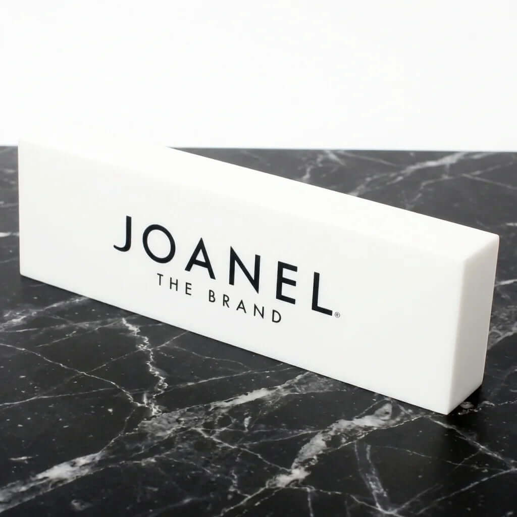 Custom white acrylic branding blocks for jewelry store logo display, 7x3.15x2 inches, featuring silk-screened branding.