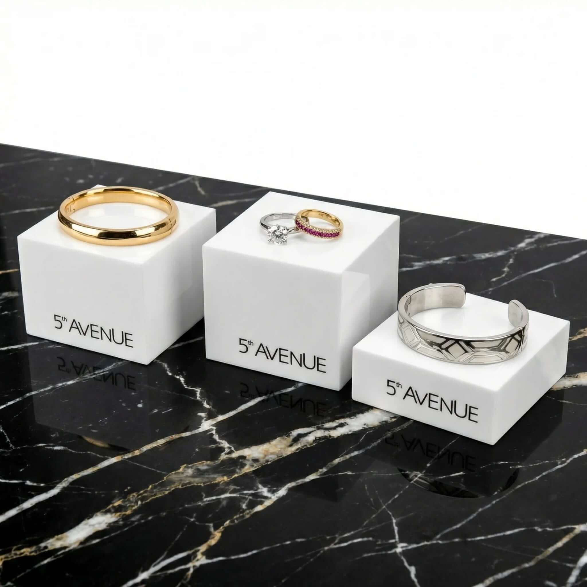 3-piece set of white acrylic jewelry display risers for luxury rings and bracelets, featuring custom logo options.