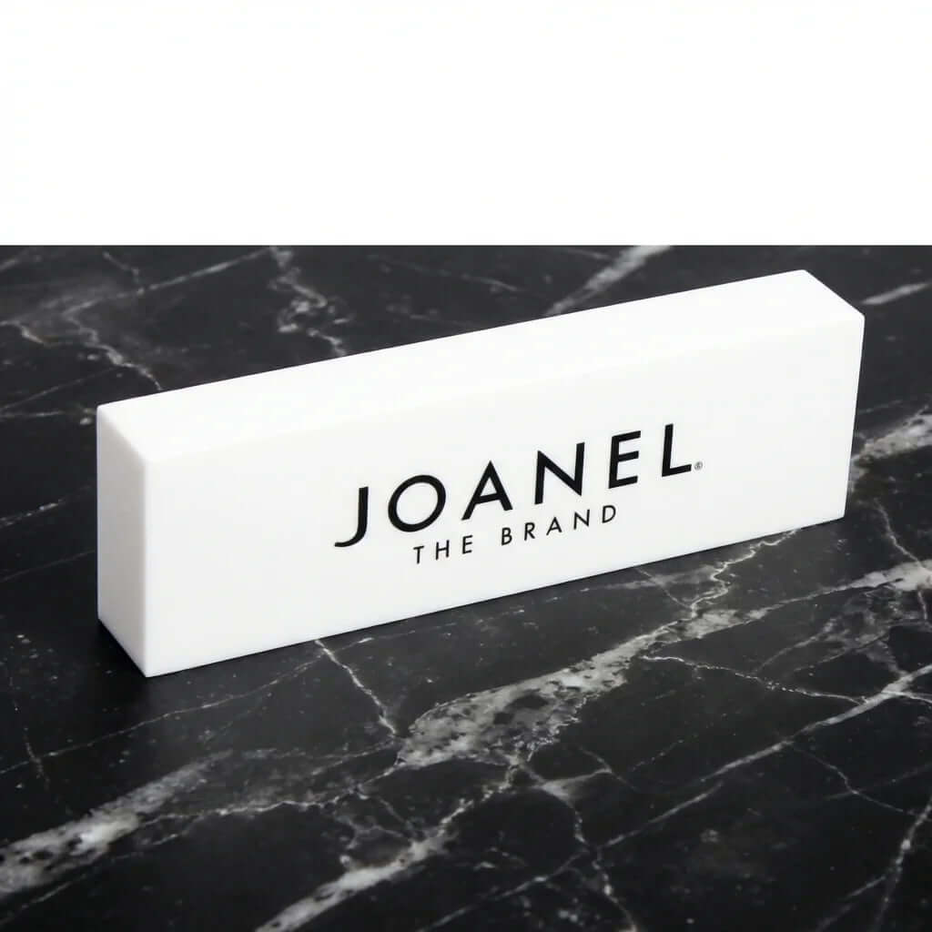 Custom white acrylic branding block with printed logo for jewelry retail counter display, 7x3.15x2 inches.